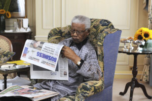 Nelson Mandela reading newspaper