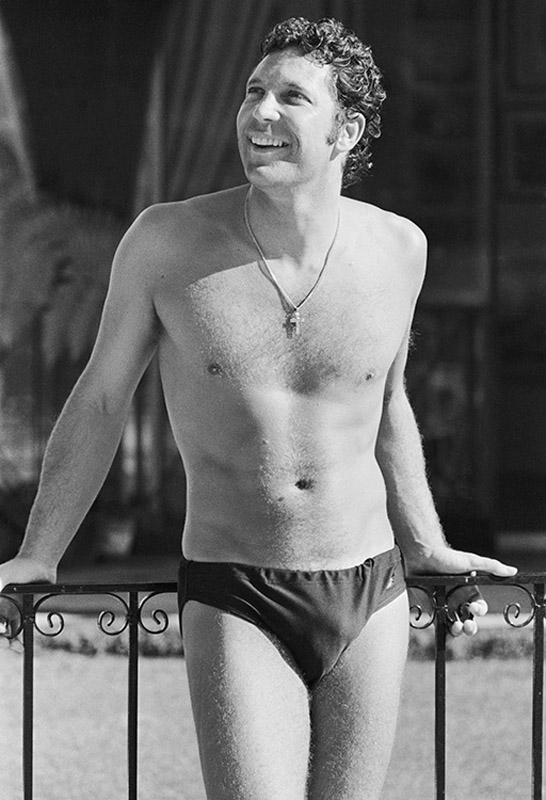 Welsh singer Tom Jones wearing only swimming trunks, circa 1968. 